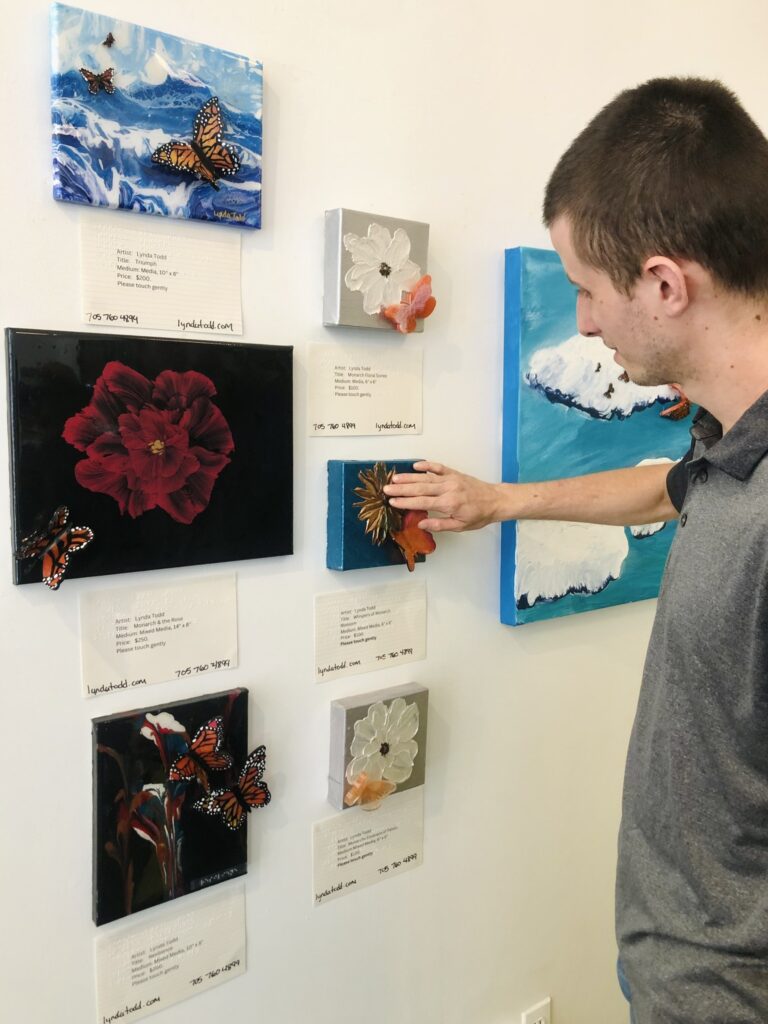 Man touching the art at gallery opening