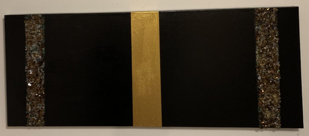 "Glimmering Borders of Silence" is a 20" x 48" mixed media artwork with a bold vertical gold stripe flanked by deep black sections. Two slender textured bands near the edges shimmer with mosaic-like details, adding visual intrigue and contrast to the minimalist design.