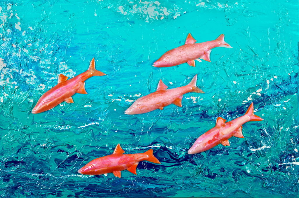 "Artwork titled 'Spawn of the Salmon' depicting five orange salmon swimming in a textured ocean with rich turquoise-blue water and dynamic white brushstrokes. The vibrant colors and swirling background create a lively impression of underwater life and movement."